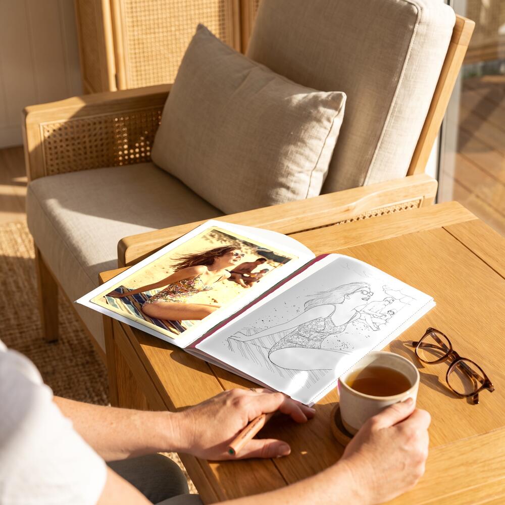 A photo on the left page and the same moment as a colouring page on the right.