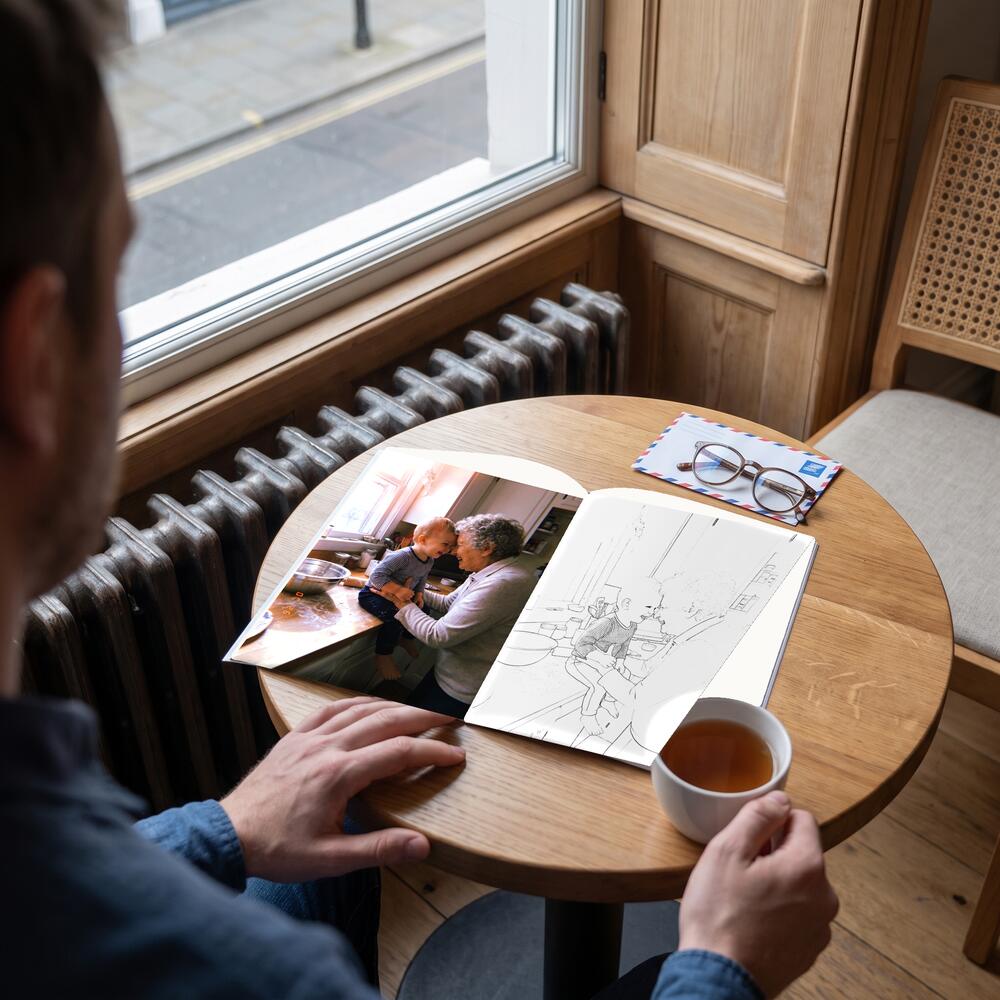 A photo on the left page and the same moment as a colouring page on the right.