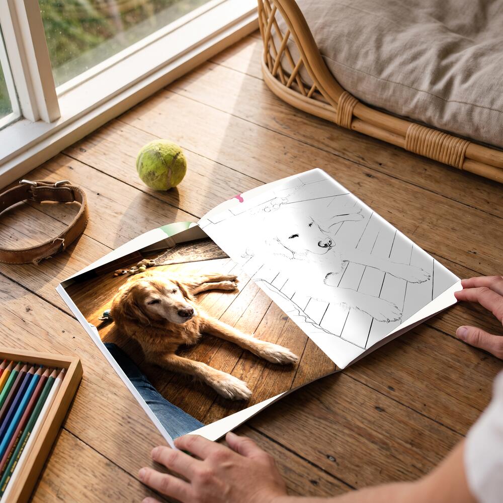 A photo on the left page and the same moment as a colouring page on the right.