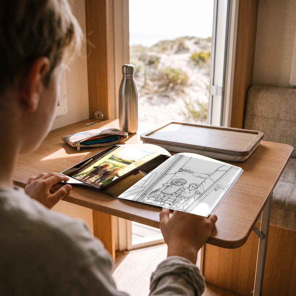 A photo on the left page and the same moment as a colouring page on the right.